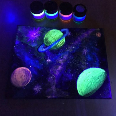 glow in the dark outer space painting using art 'n glow's glow in the dark paints. Colors used: Fluorescent yellow, green, red and Neutral white.